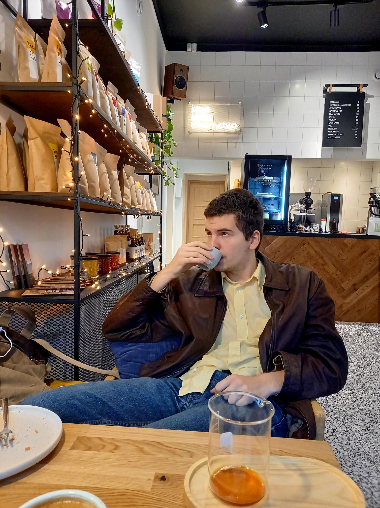 Photo of me, sitting at a cafe